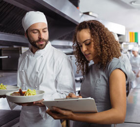 Experts discussing food in the kitchen