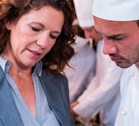 Experts discussing food in the kitchen