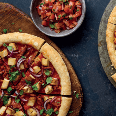 Pizza on a wooden slab